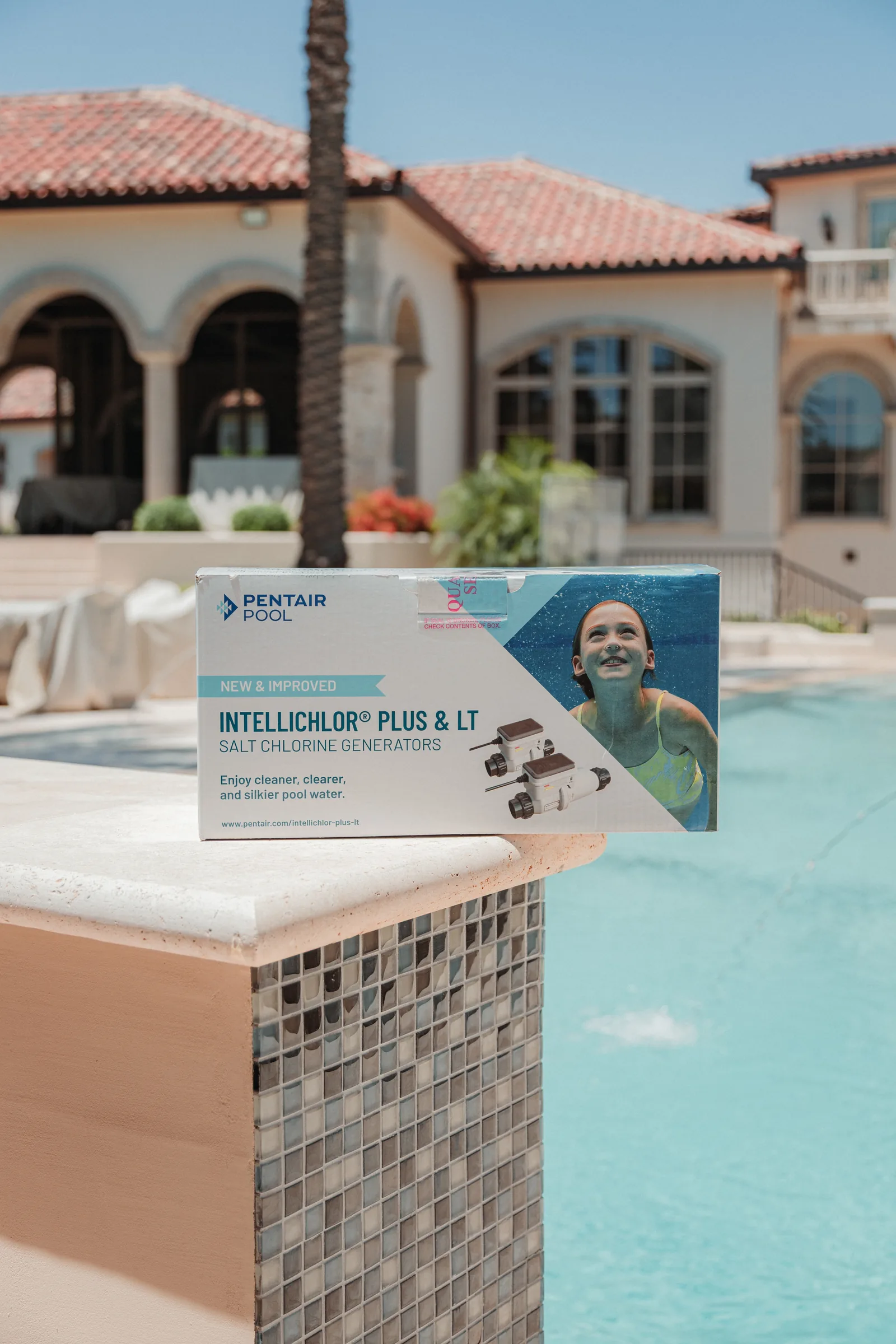 Pentair IntelliChlor salt chlorine generator beside a pool